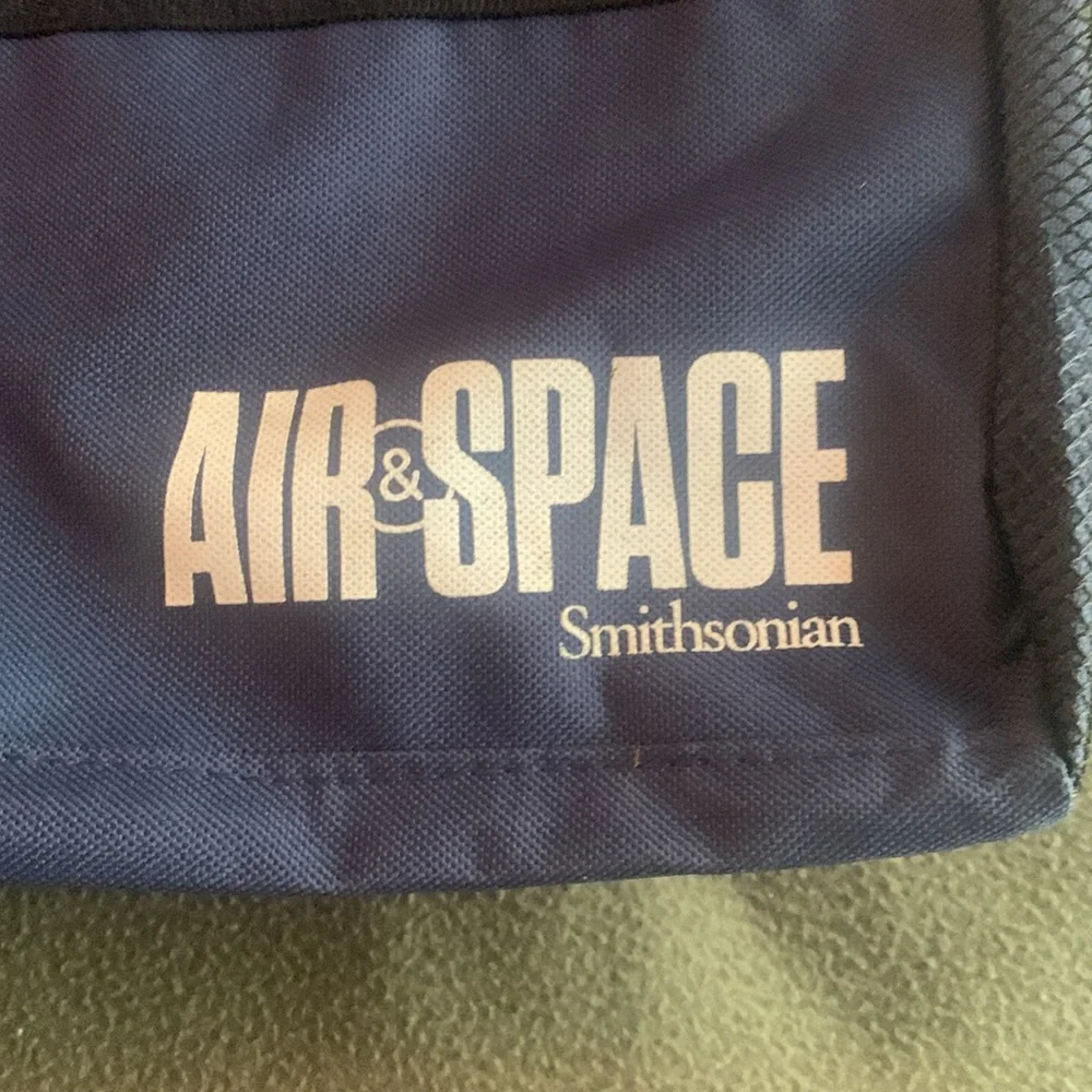 Smithsonian Air & Space blue and black duffel bag. Approx 17” x 9” x 7 1/4”